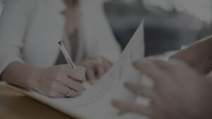 Woman signs contract